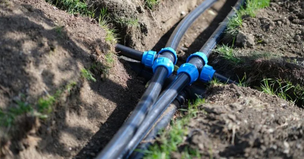 Plumbing professional working on a pipe repair